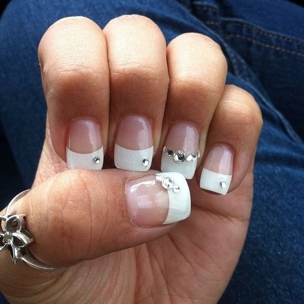 Chic Elegant French Tip Nails with Rhinestone Embellishments for Glamorous Style.