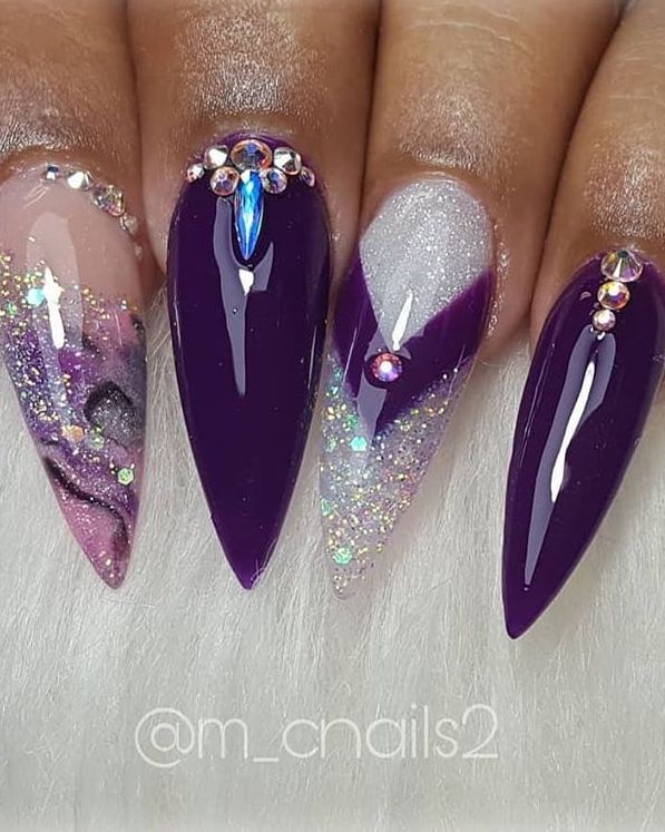 Elegant Vibrant Purple Nail Design with Textures, Glitter, and Gem Embellishments