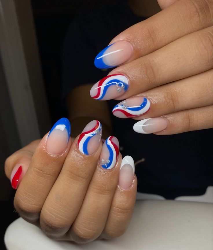 Striking Vibrant Nail Design: Bold Colors and Intricate Patterns with Modern Elegance.