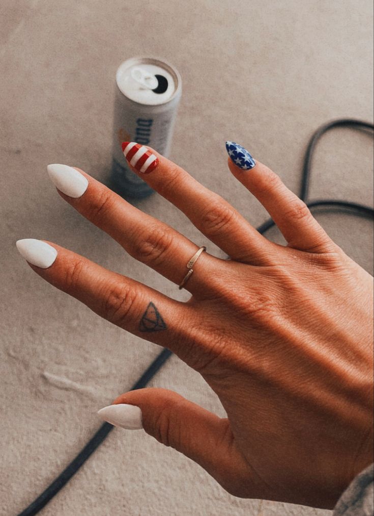 Patriotic Nail Design: Bold White with Red Stripes and Blue Stars for Individuality and National Pride.