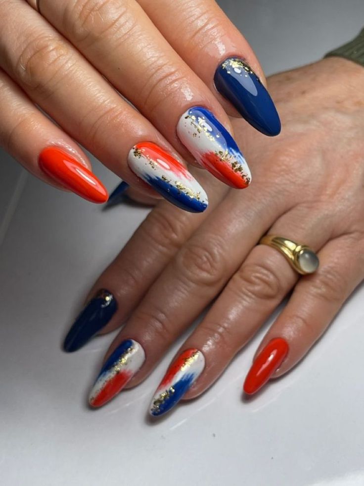 Elegant Vibrant Nail Design with Artistic Brush Strokes and Glamorous Glitter.