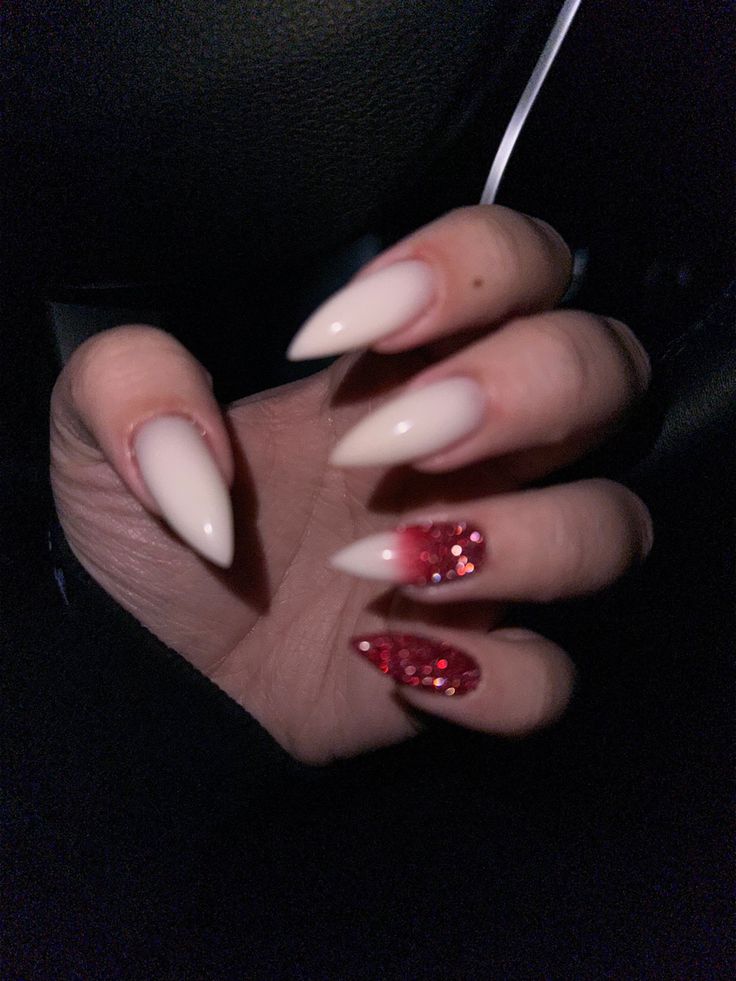 Sophisticated Nail Design: Classic Nude with Playful Red Glitter Accents