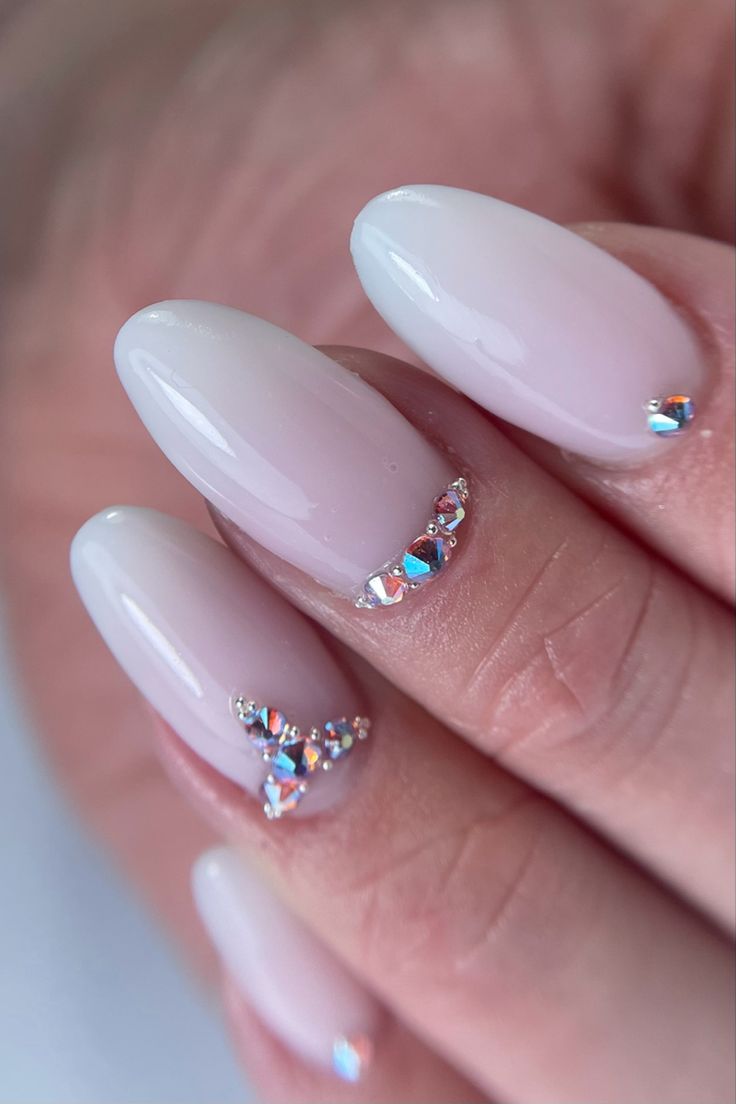 Chic Soft Pink Nail Design with Rhinestone Elegance for Any Occasion.