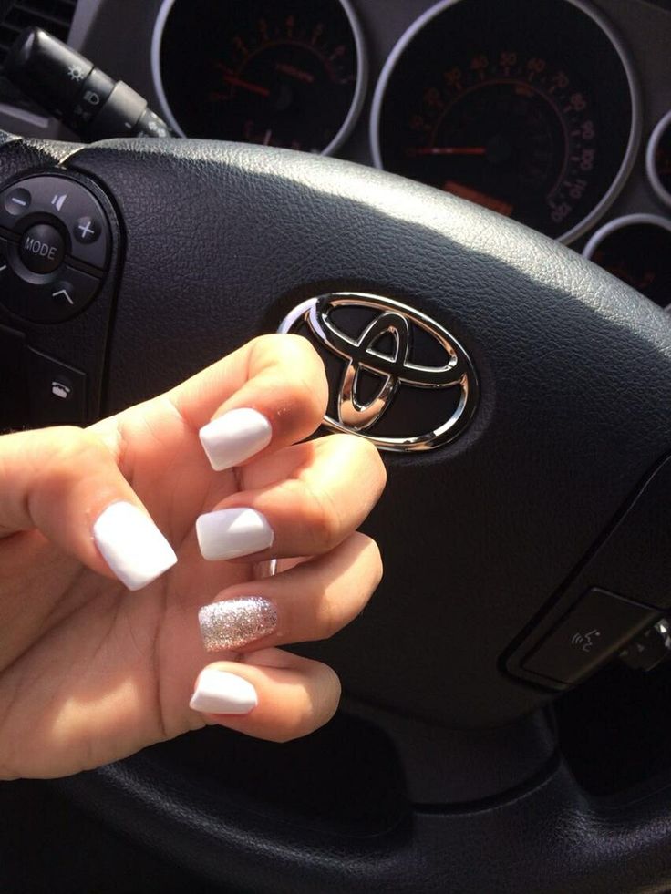 Elegant Classic White Nail Design with Sparkling Accent.