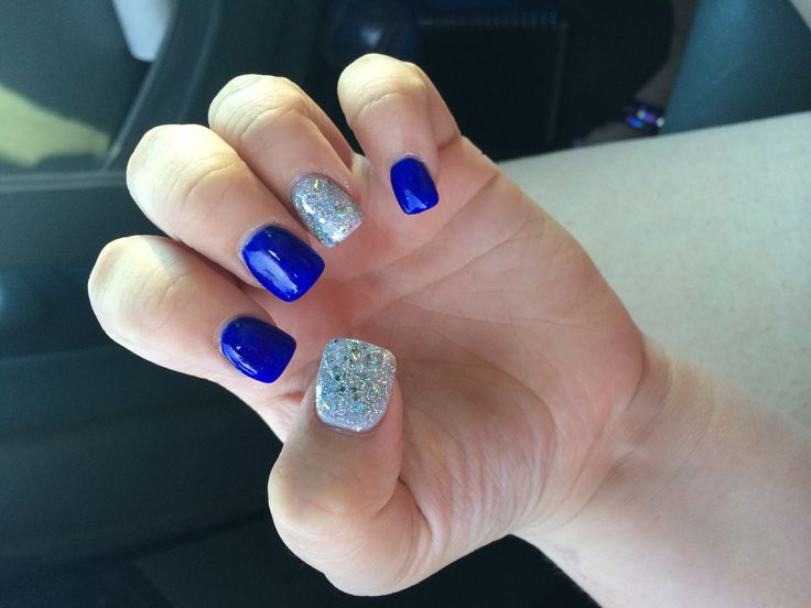 Eye-Catching Vibrant Blue Nail Design with Glossy and Glitter Finishes