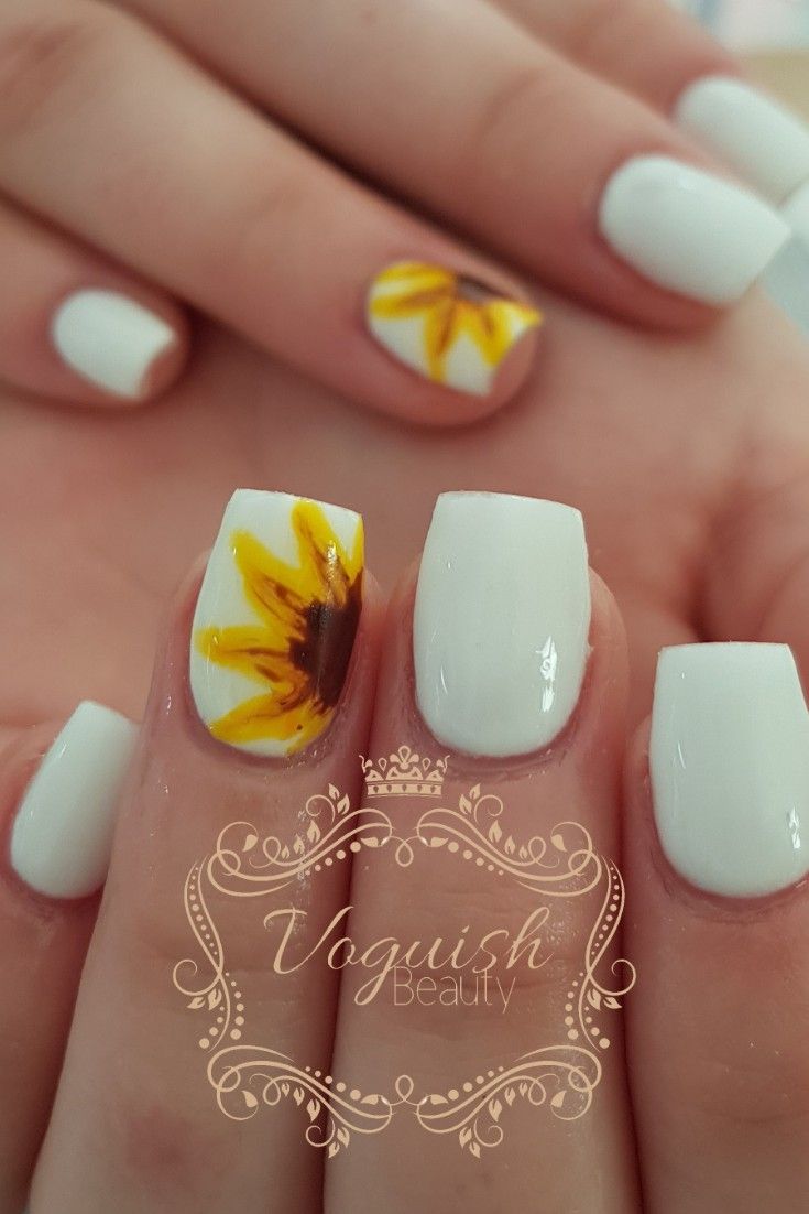 Spring-Inspired Elegant Nail Design with Crisp White Base and Cheerful Sunflower Accents.