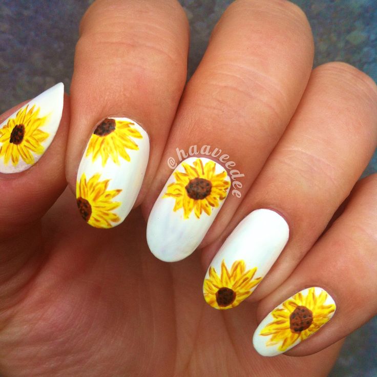 Vibrant Sunflower Nail Art: Cheerful Yellow Blooms on Crisp White Background.