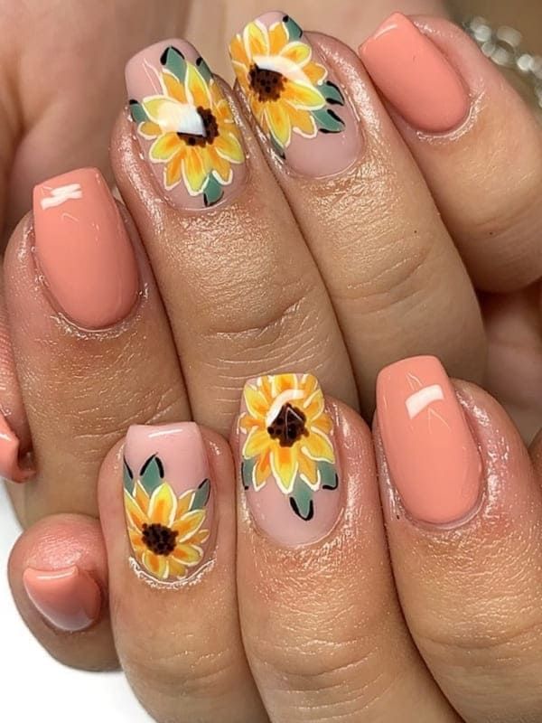 Cheerful Floral Nail Design with Sunflowers and Soft Peach Base