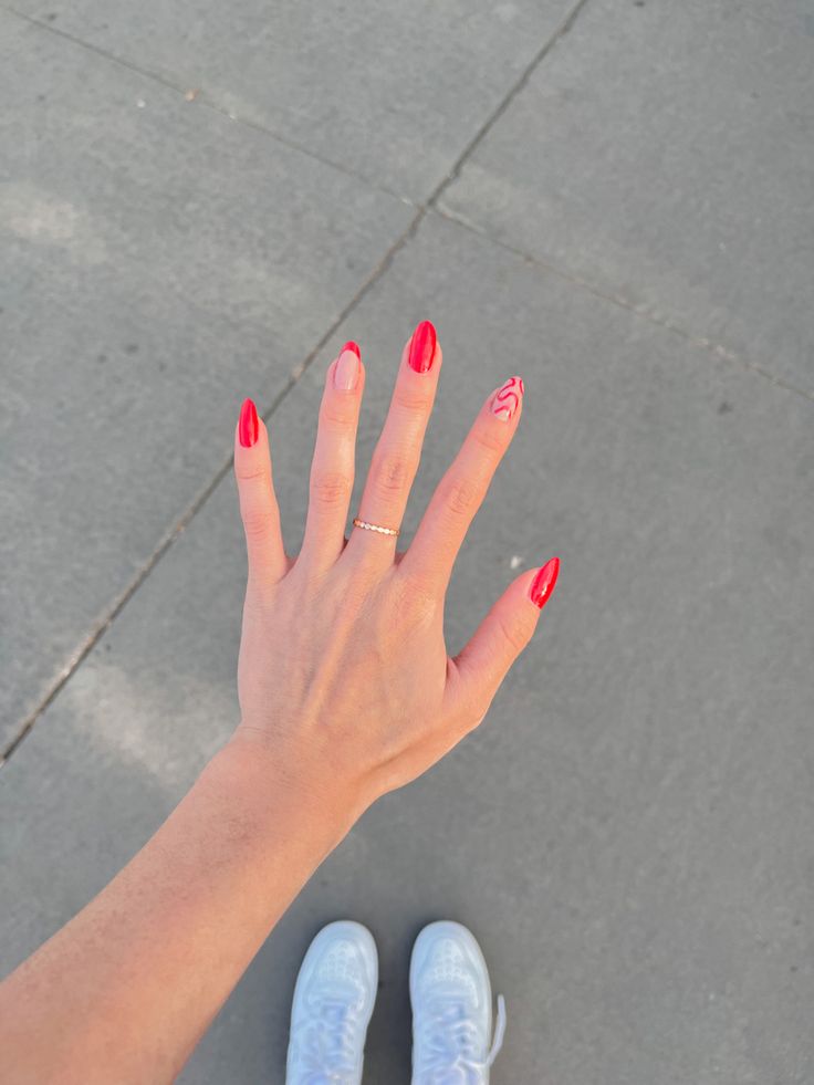 Chic Red Almond Nails with Glossy-Matte Finish and Artistic Accent Design