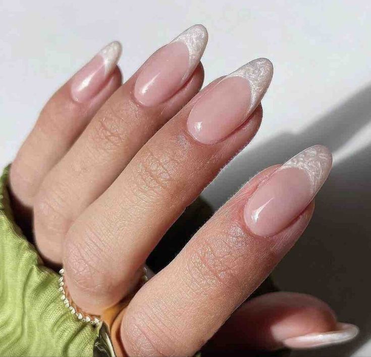 Chic Almond-Shaped French Manicure with Nude Base and Glossy White Tips.