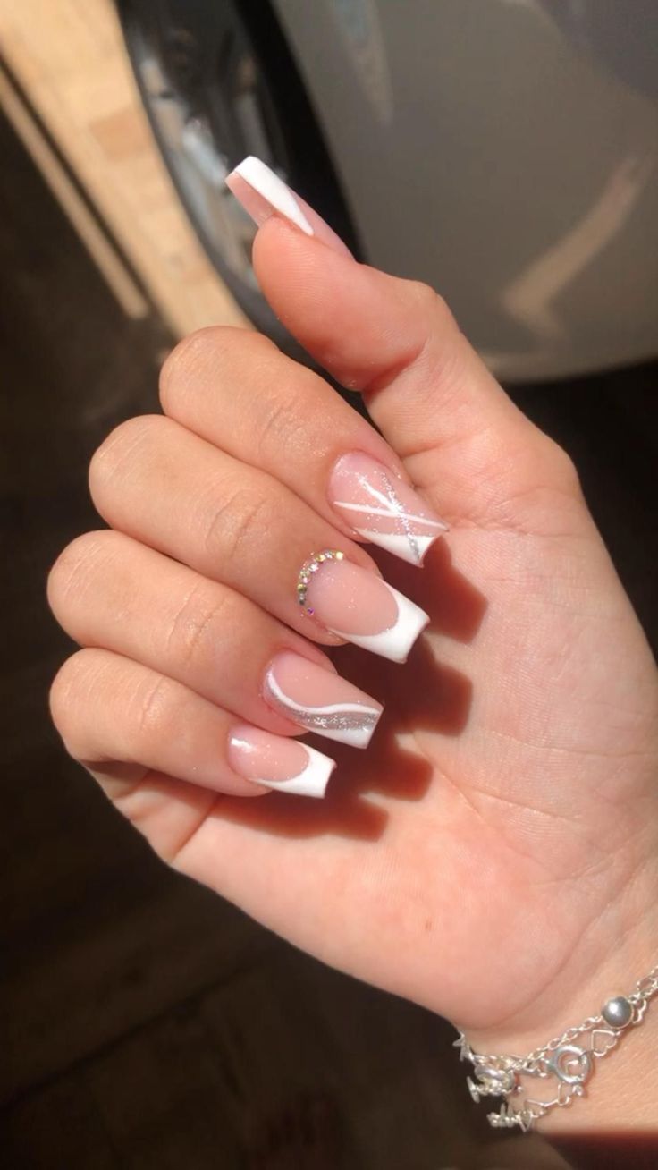 Chic Glossy French Tip Nails with Silver Accents and Rhinestone Glamour