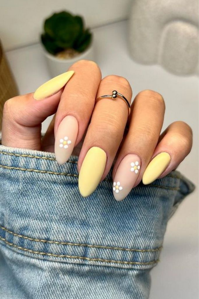 Elegant Pastel Nail Design: Soft Yellow and Beige with Floral Accents for Spring Vibe