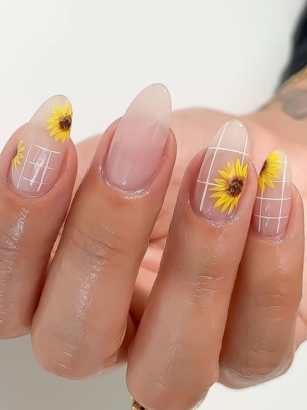 Cheerful Sunflower Nail Design: Elegant Artistry on a Clear Base with Grid Patterns