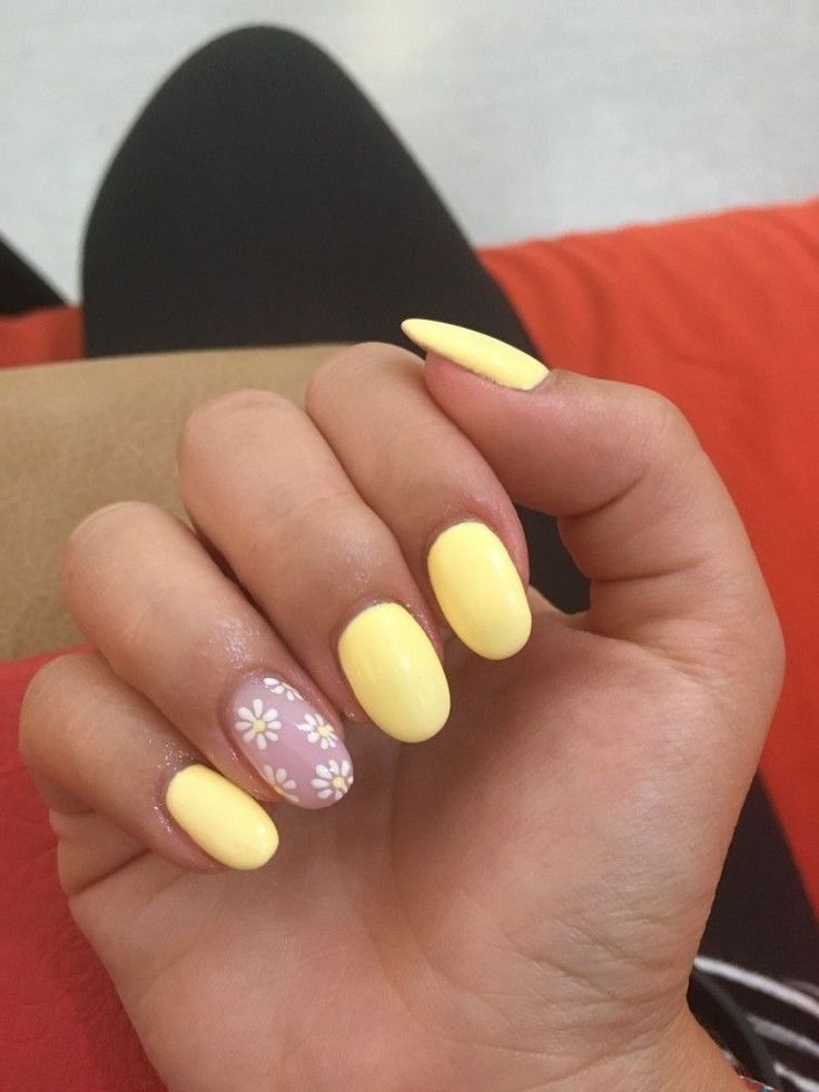 Vibrant Yellow and Playful Pink Nail Design with Floral Accent for Spring/Summer Fun.