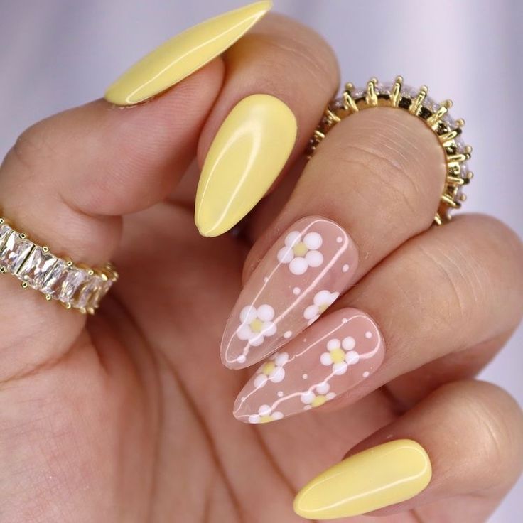 Cheerful Spring Nail Design: Glossy Yellow Almonds with Delicate Floral Accents