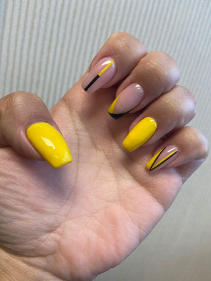 Chic Vibrant Nail Design: Bold Yellow and Soft Nude with Geometric Accents