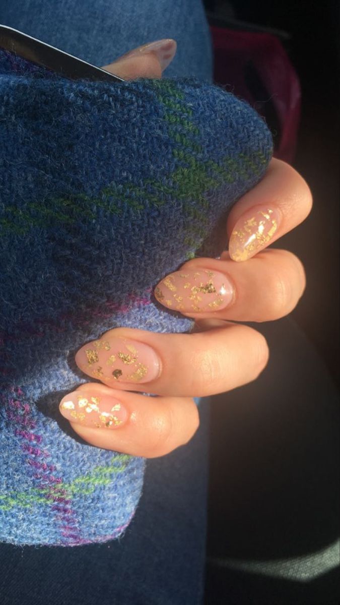 Sophisticated Soft Pink Nail Design with Glamorous Gold Flakes.