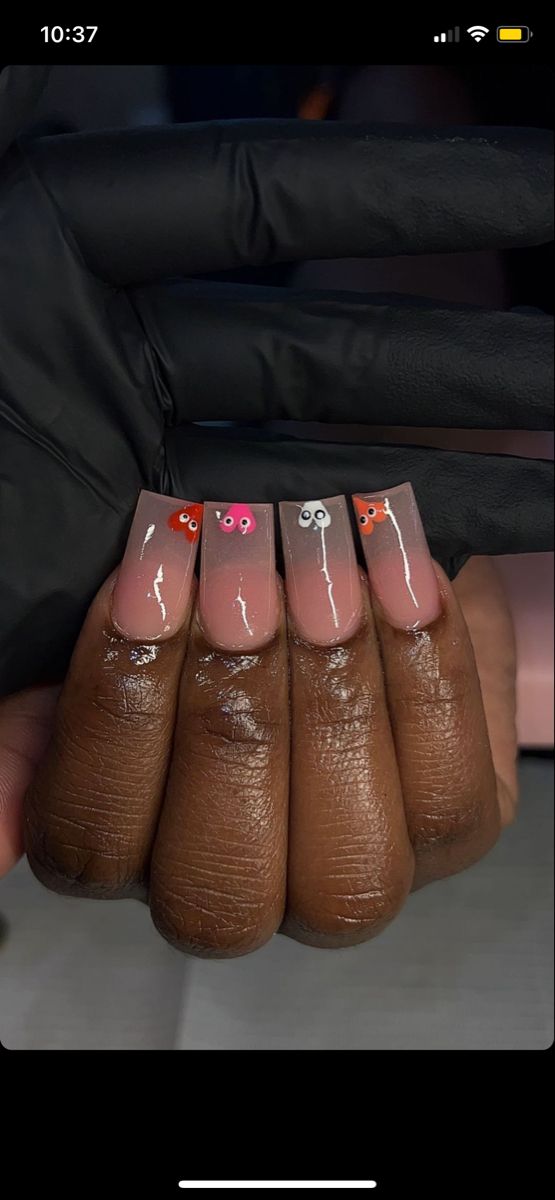 Whimsical Gradient Nail Art with Cartoon Characters on a Nude Base