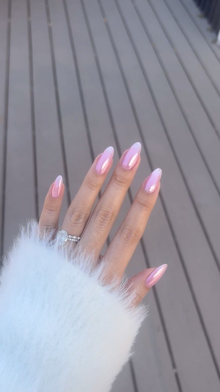 Chic Almond-Shaped Gradient Nail Design in Soft Pink with Elegant Accents.