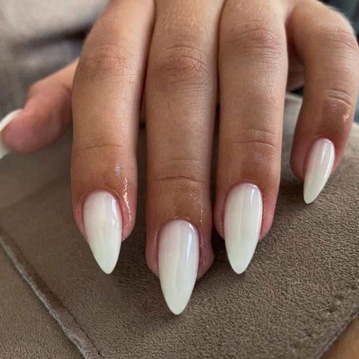 Sophisticated Ombre Stiletto Nails: Chic Pink to White Transition for Modern Glamour.