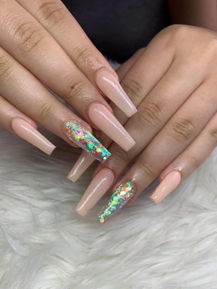 Elegant Glossy Nude Acrylic Nails with Playful Multicolored Glitter Accent.