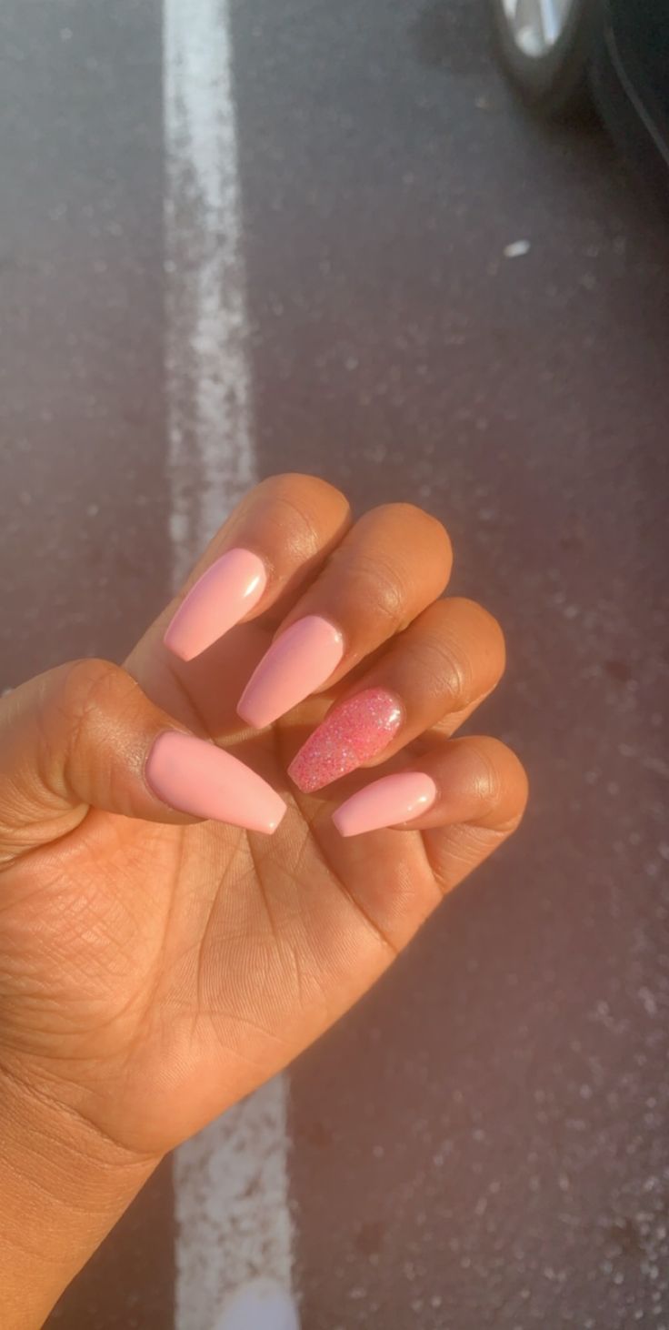 Elegant Soft Pink Long Nails with Glamorous Glitter Accent