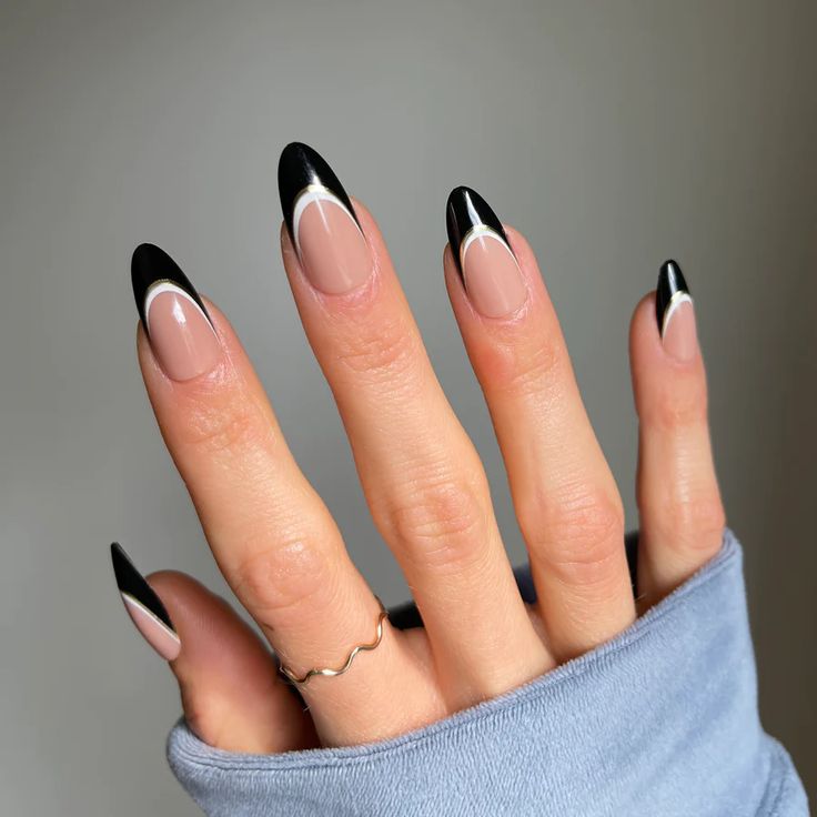 Elegant Black-Tipped Almond Nails with Subtle White Accents