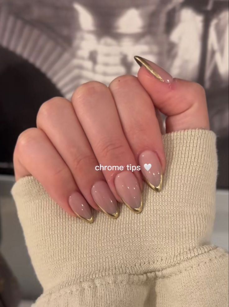 Elegant Nail Design: Soft Nude Base with Striking Chrome Tips for Sophisticated Style.