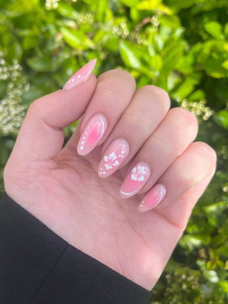 Elegant Pink Gradient Nail Design with Floral Accents and Pastel Shades