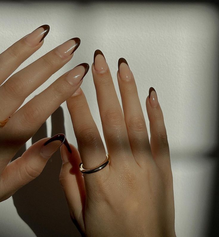 Chic French Tip Nails in Rich Brown: Modern Elegance with a Nude Base.