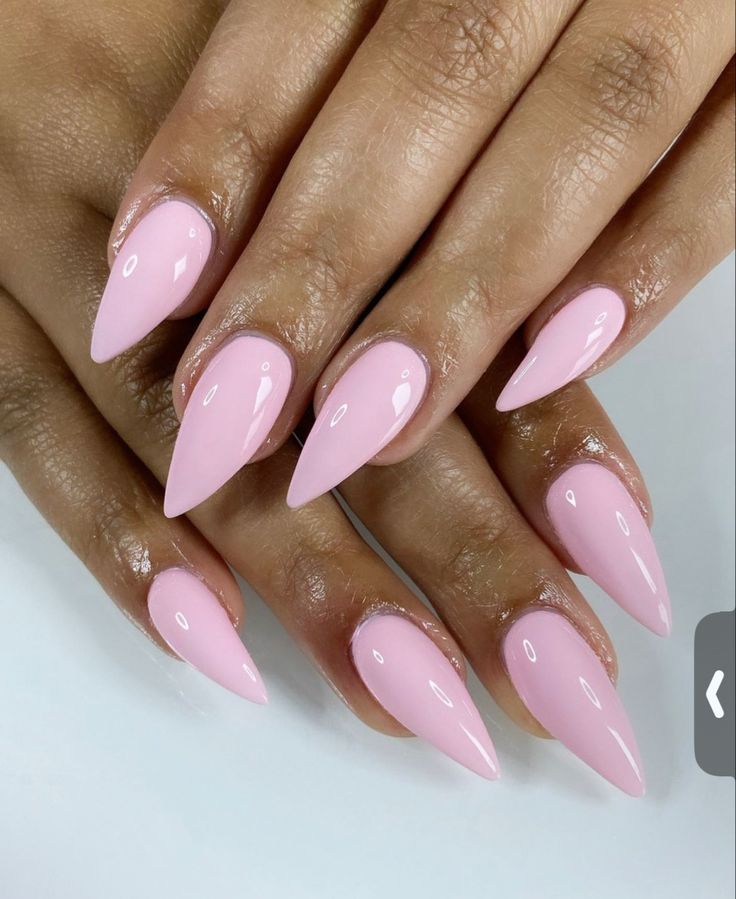 Chic Soft Pink Stiletto Nails: A Sophisticated Manicure for Every Occasion.