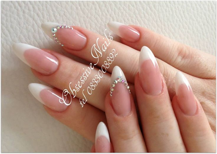 Sophisticated Almond French Tip Nails with Soft Pink Base and Rhinestone Accents.