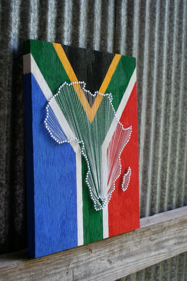 Vibrant String Art of Africa on Painted Wood Reflects Cultural Pride and Artistic Expression.