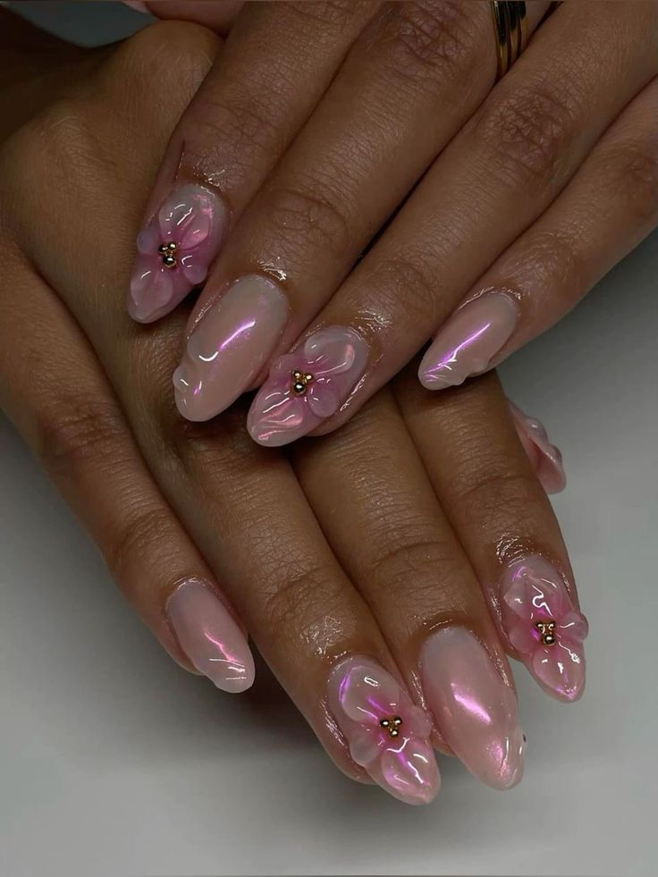 Elegant Floral Nail Design with Soft Pink Hues and 3D Accents.