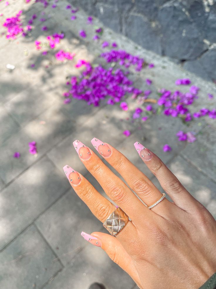 Chic Soft Pink Nail Design with Floating Heart Accents for Spring/Summer.