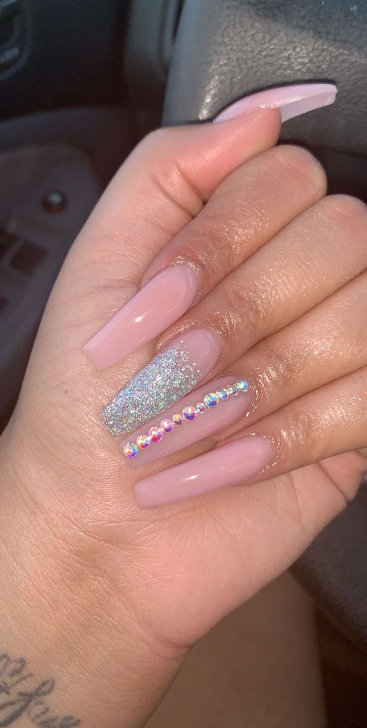 Chic Soft Pink and Sparkling Silver Nail Design with Glamorous Rhinestone Accents.