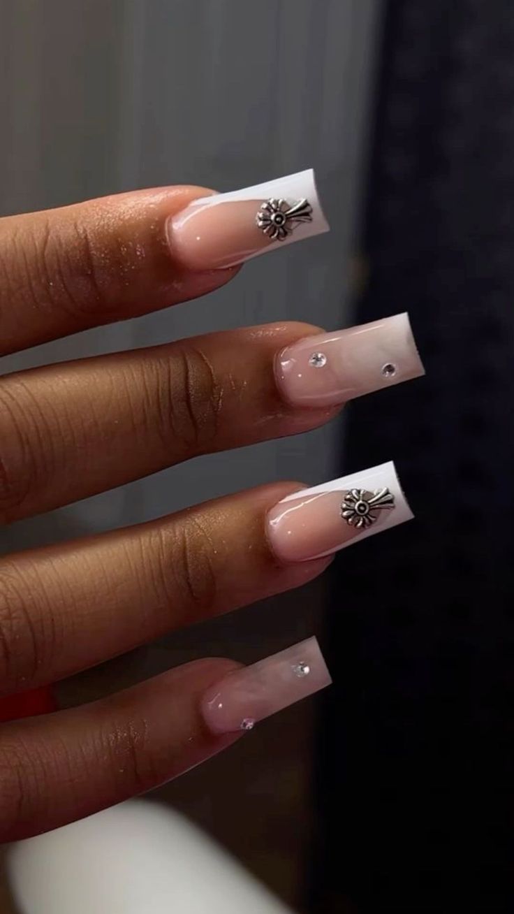 Sophisticated Ombre Nail Design in Soft Pink and White with Glamorous Embellishments.