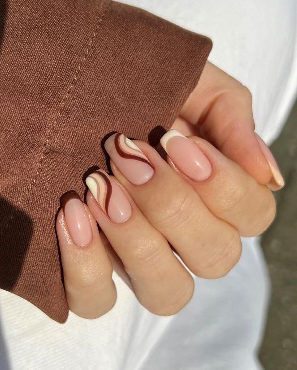 Chic Nail Design: Soft Pink and Beige with Elegant Brown Swirls