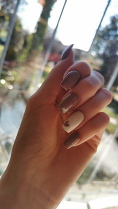 Charming Taupe and White Pointed Nail Design with Heart Accent