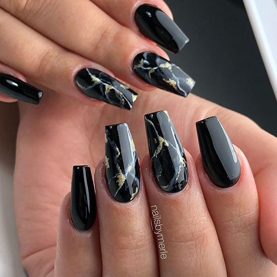 Chic Elegant Black Nail Design with Glossy Finish and Marble Accents