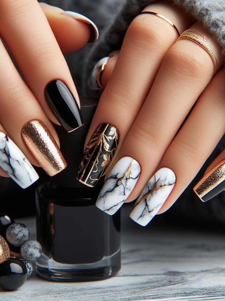 Sophisticated Nail Design: Glossy Black and Shimmering Copper with Marble Accents and Gold Foil Detailing.