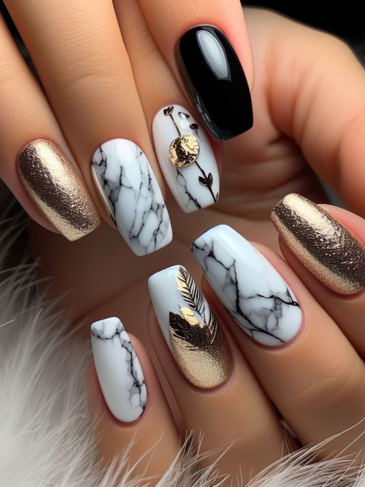 Luxurious Marble-Inspired Nail Design with Metallic Accents and Unique Finishes.