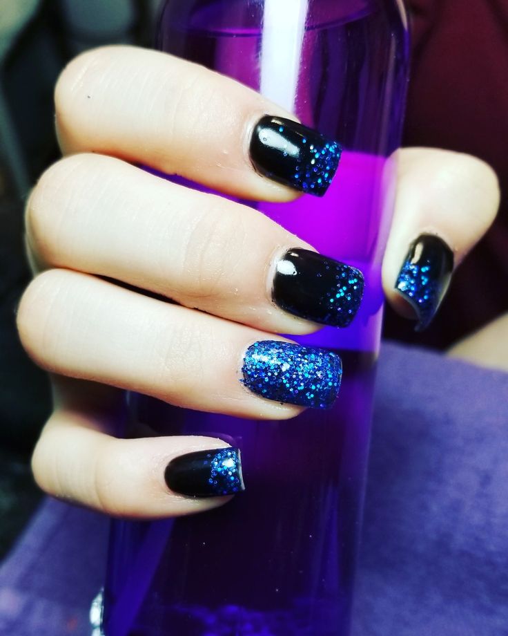 Glamorous Deep Black and Vibrant Blue Glitter Nail Design for Any Occasion