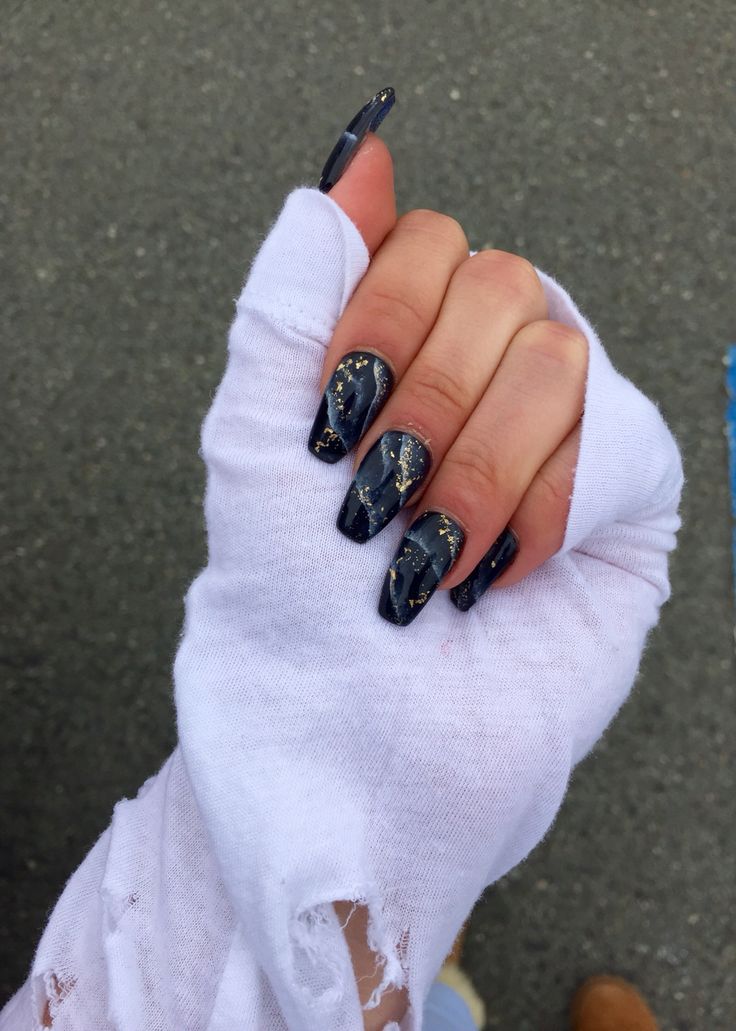 Sophisticated Black and Gold Nail Design for Bold Statement.