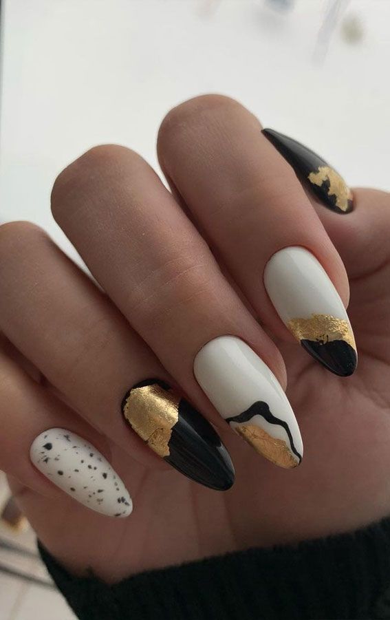 Chic Nail Design: Striking Black, White, and Gold Elegance