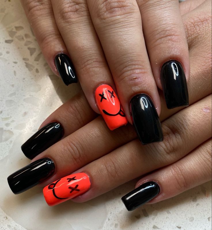 Edgy Black and Orange Manicure with Playful Smiley Face Designs