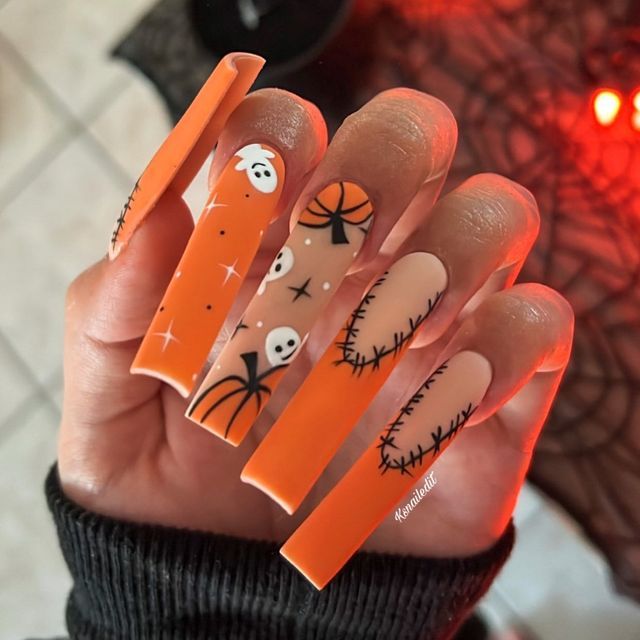 Festive Halloween Nail Design: Striking Orange and Nude Shades with Playful Ghosts and Pumpkins