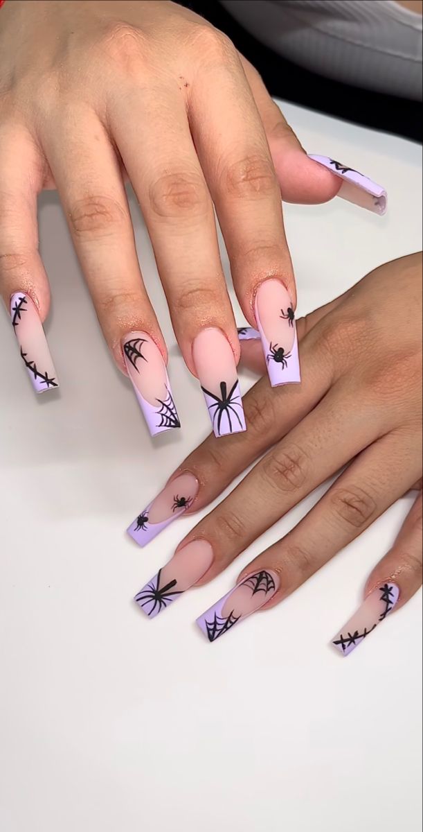 Playful Halloween-Inspired Nail Design with Lavender and Nude Gradient and Spooky Spider Patterns.