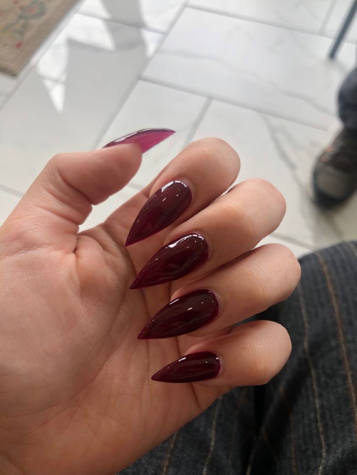 Elegant Glossy Burgundy Elongated Almond Nail Design