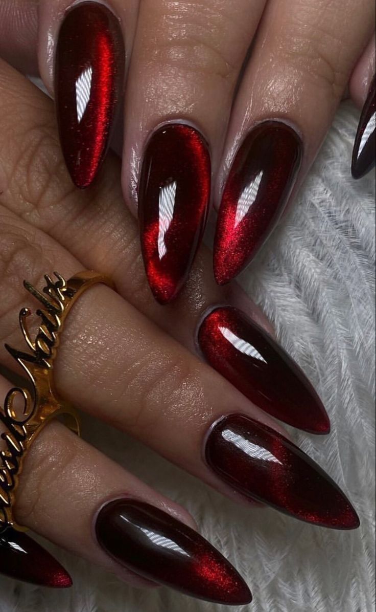 Elegant Long Almond-Shaped Nails in Glossy Deep Red with Metallic Sheen